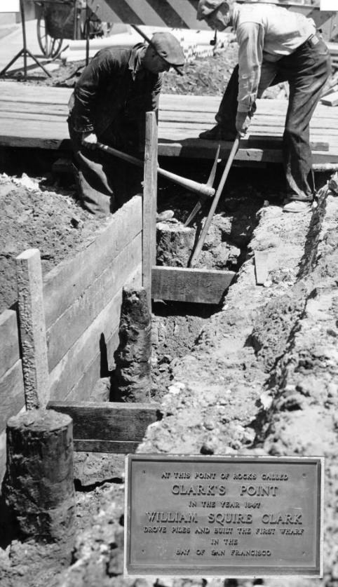 Workmen uncovering old piles of Clark's Point Wharf at the Embarcadero, 1938