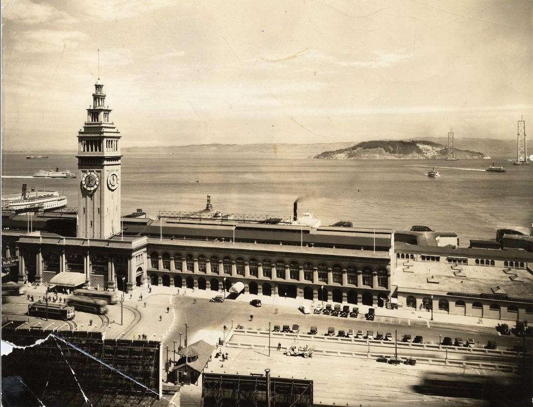View of Ferry Building with Bay Bridge under construction in the background, 1935