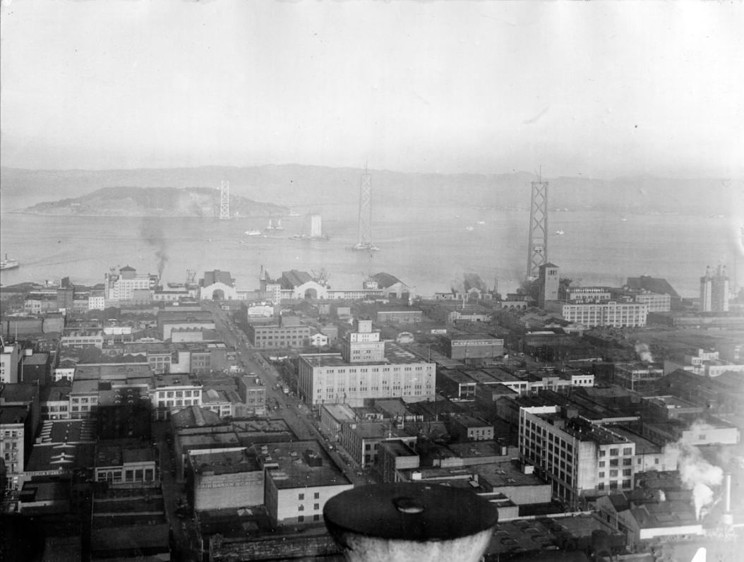 View of Bay Bridge towers under construction and Yerba Buena Island, 1934