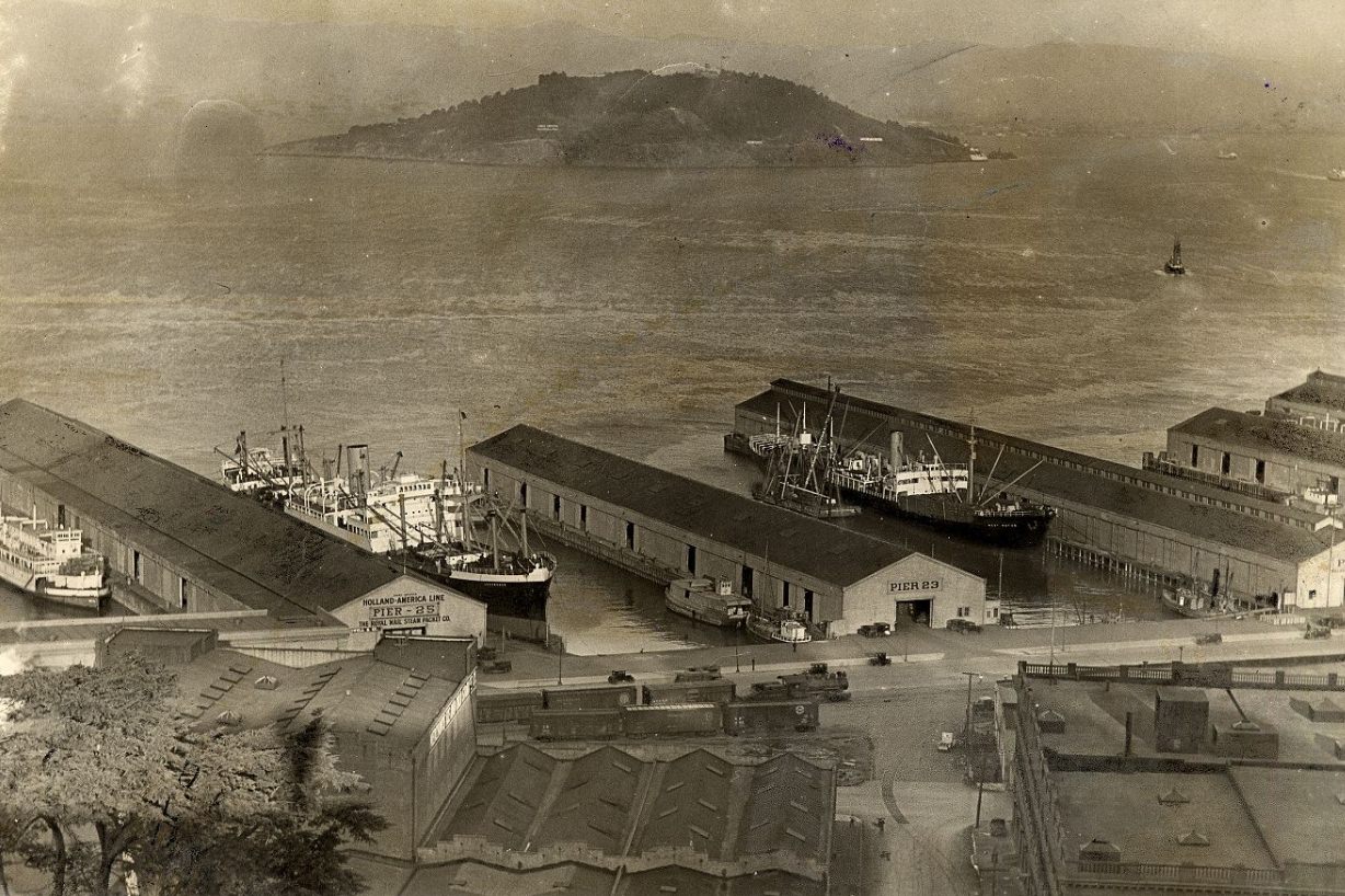 Piers 25, 23, and 21 with Yerba Buena in the background, 1930s