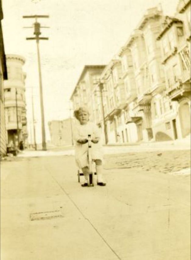 Unidentified child on the 500 block of Clay Street, 1930s