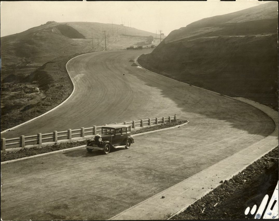 Car driving on a Twin Peaks road, 1930