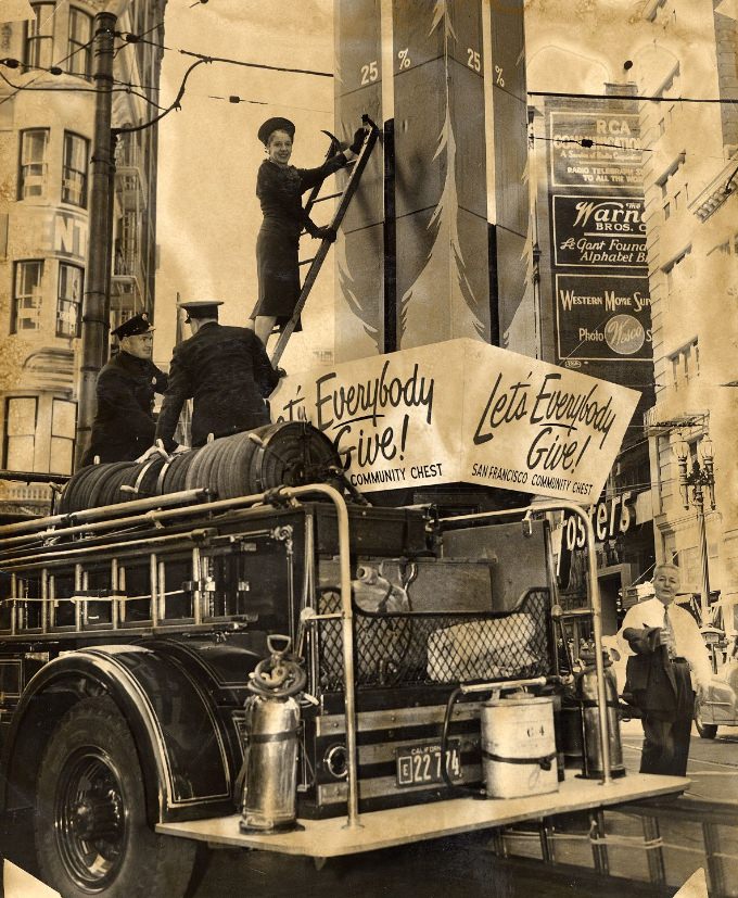 Fireman George Harper and Lieutenant Michael Switzer with Mrs. Edmund J. Morrissey at Lotta's Fountain, 1947