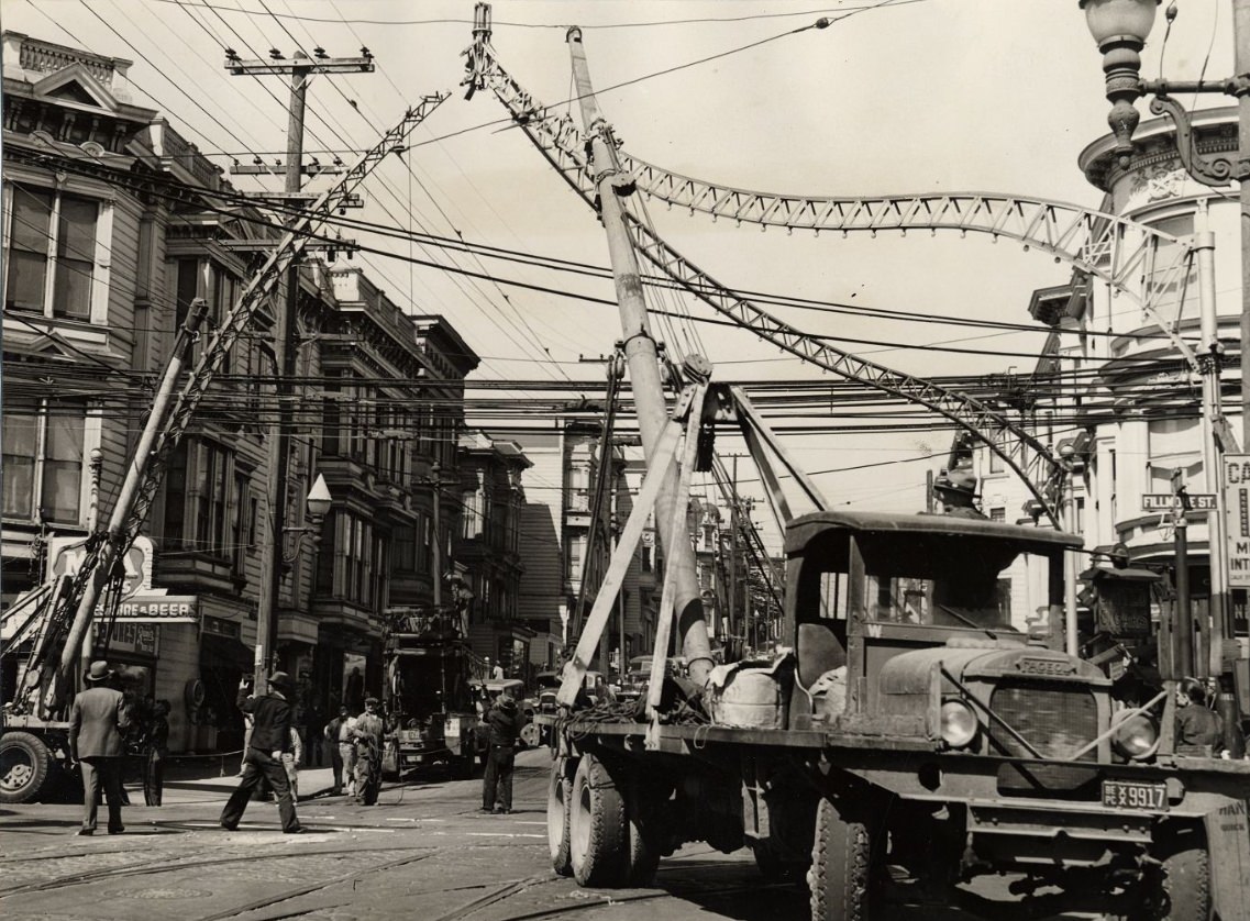 Metal arches on Fillmore Street being dismantled for scrap metal, 1943