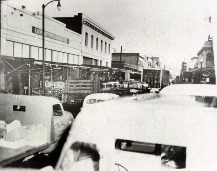 Congested streets outside the Commission District produce market, 1956.