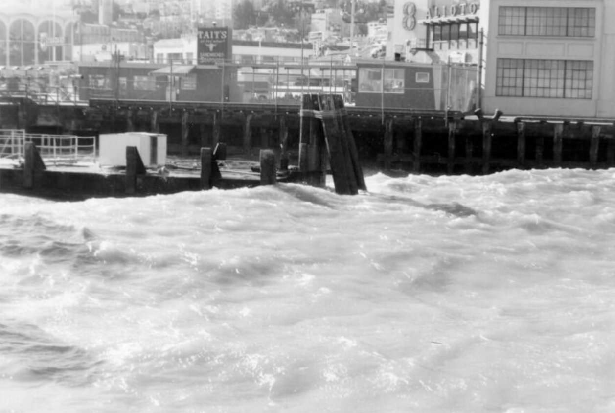 Choppy waves along Fisherman's Wharf, 1960s.