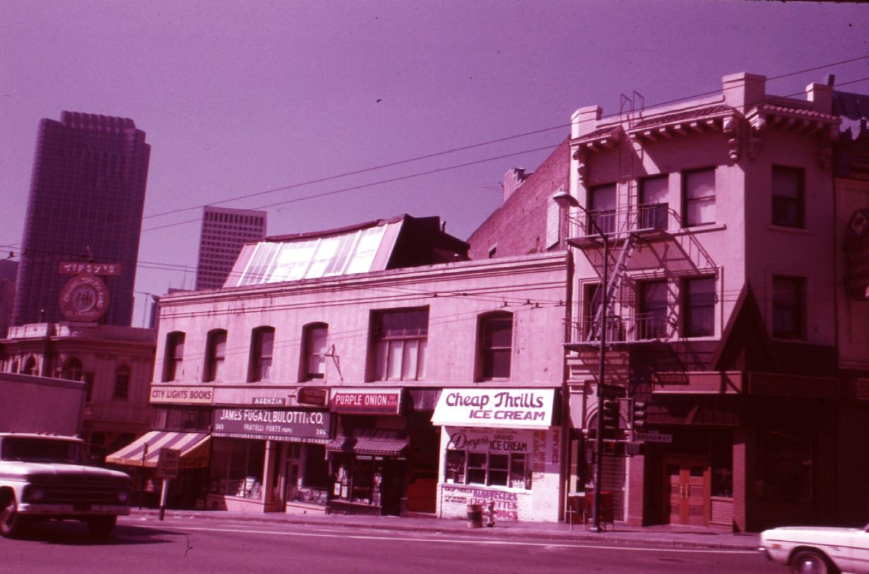 View of Southeast corner of Columbus and Broadway, 1975.