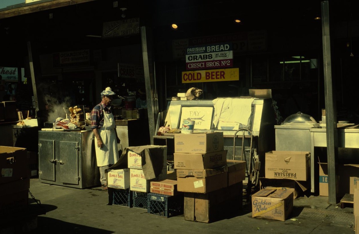 Person outside with delivery at Guardino's seafood restaurant, 1978.