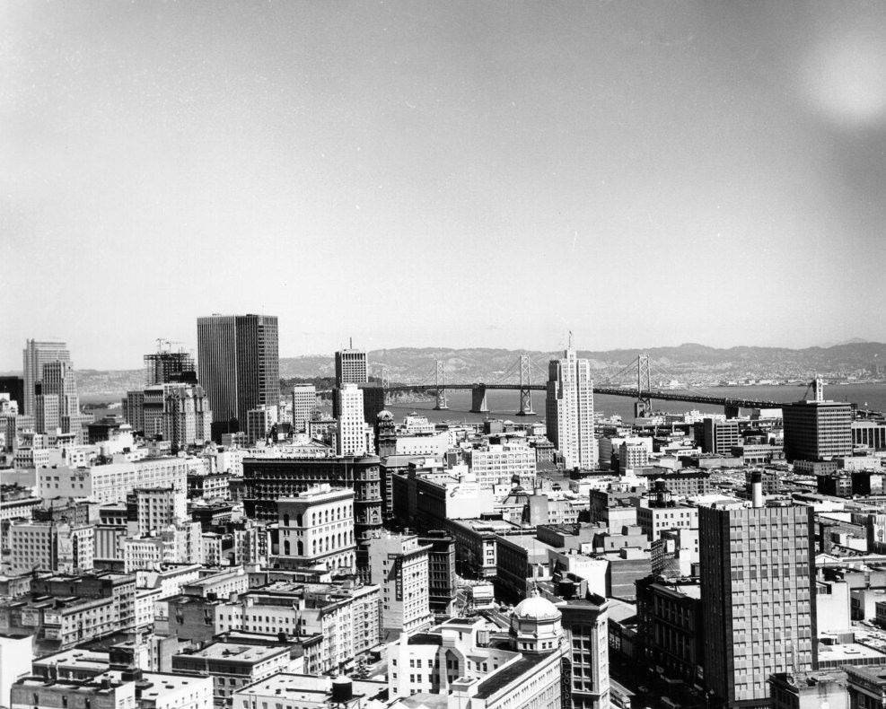 Aerial view of San Francisco looking across downtown toward the Bay Bridge, 1970s.