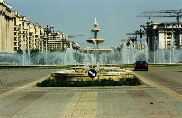 Bulevardul Unirii with fountains and tower cranes in Bucharest, 1990s