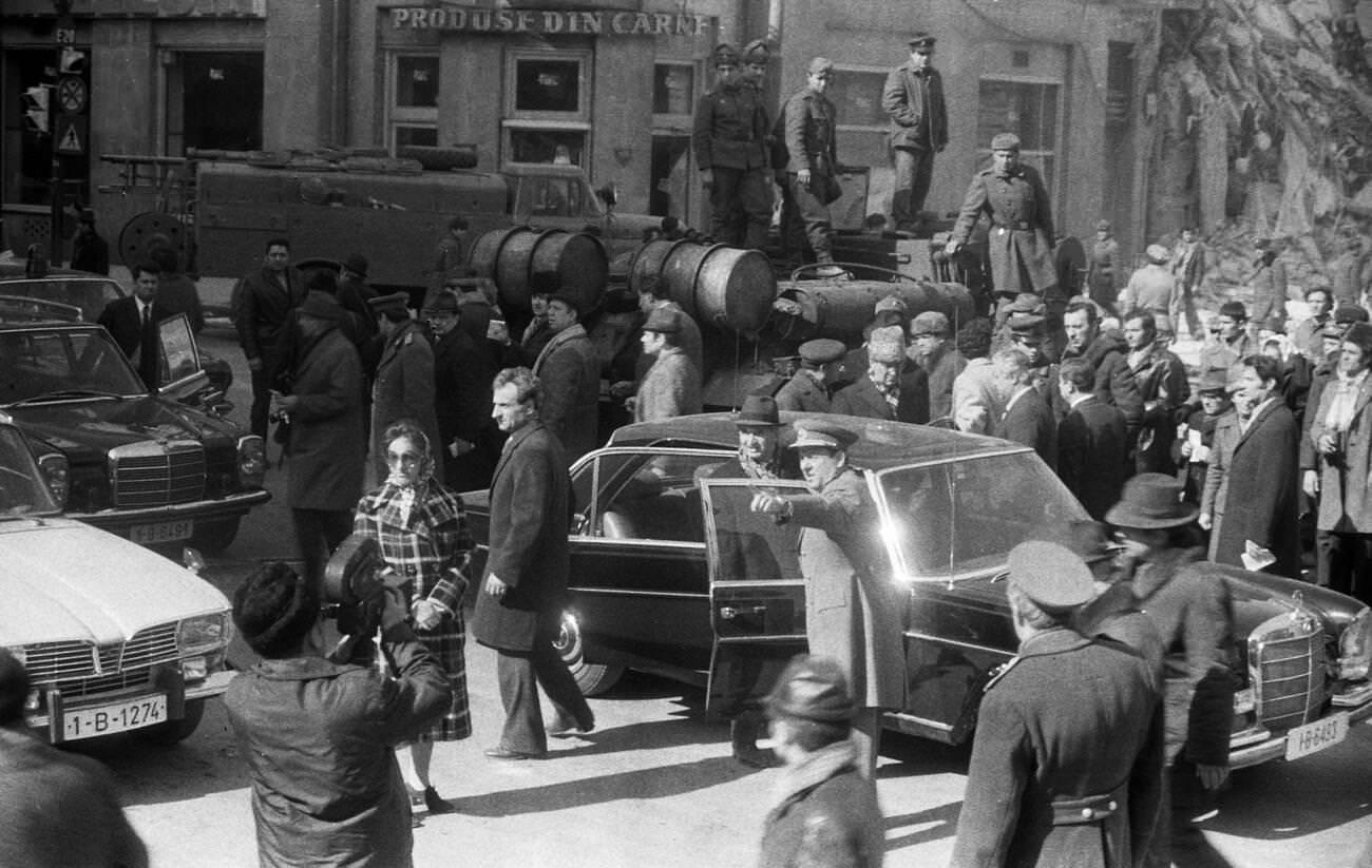 Nicolae Ceausescu and officials viewing earthquake damage in Bucharest, Romania, March 1977.