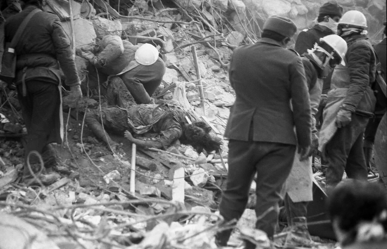 Rescuers and victim after the deadly earthquake in Bucharest, Romania, March 1977.