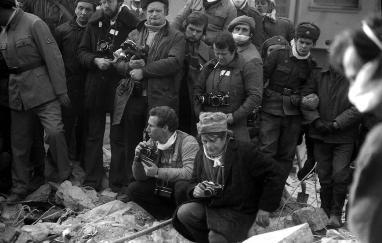 Journalists and photographer Aurel Mihailopol after the deadly earthquake in Bucharest, Romania, March 1977.
