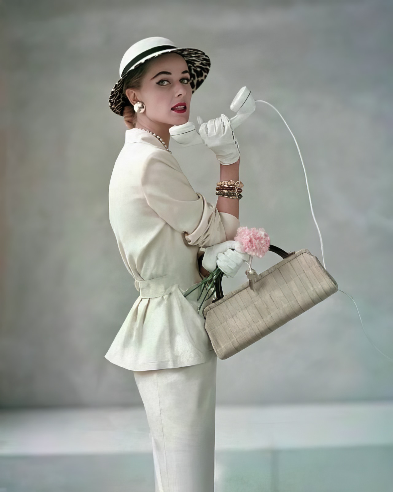 Carol McCallson in a classic suit by Handmacher, Glamour, April 1953.