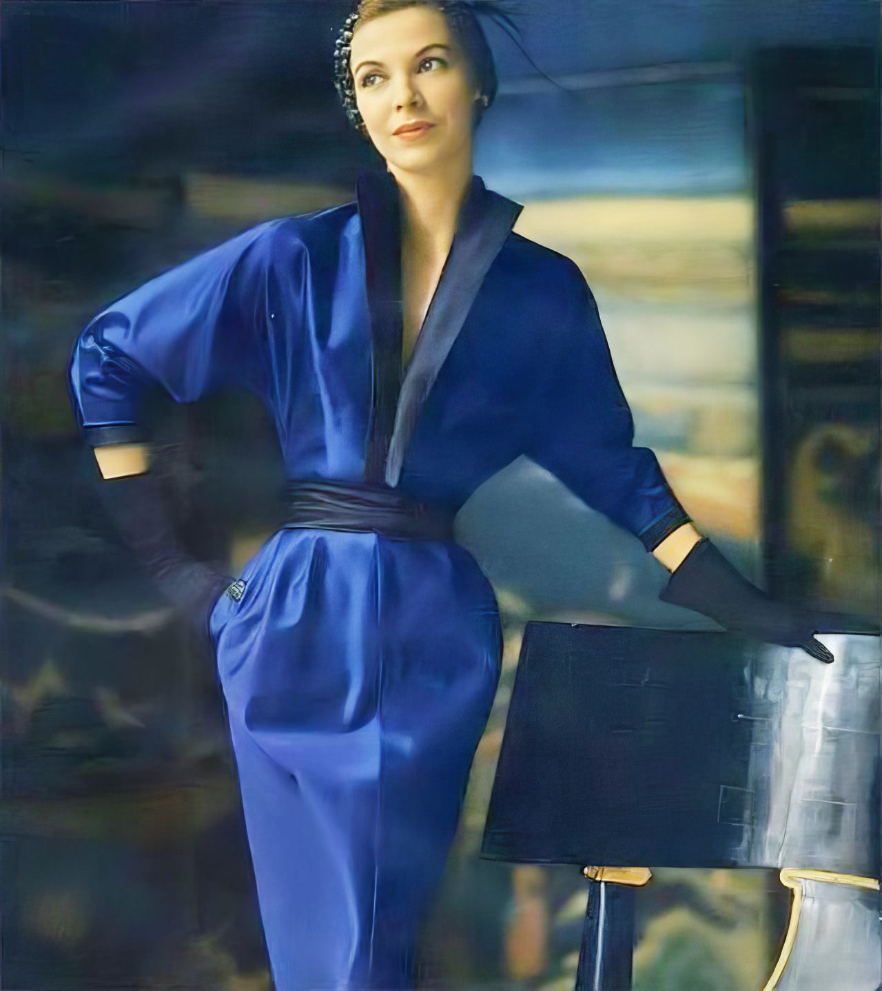 Model in a sophisticated blue silk-faille dinner-theatre dress by Adele Simpson, Vogue, September 1950.