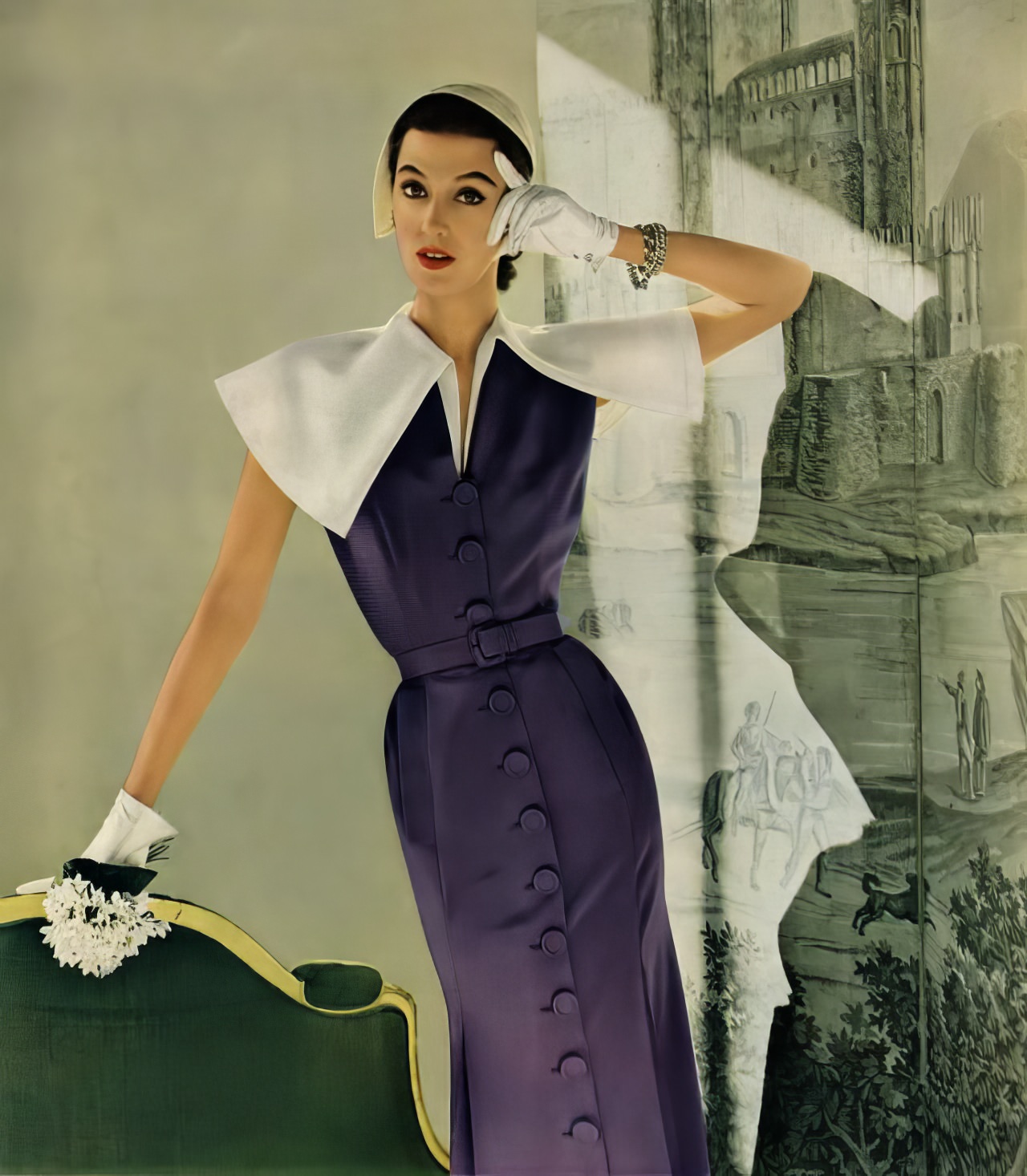 Barbara Mullen in a sleeveless crêpe and Enka rayon dress by Adele Simpson, Vogue, April 1, 1951.