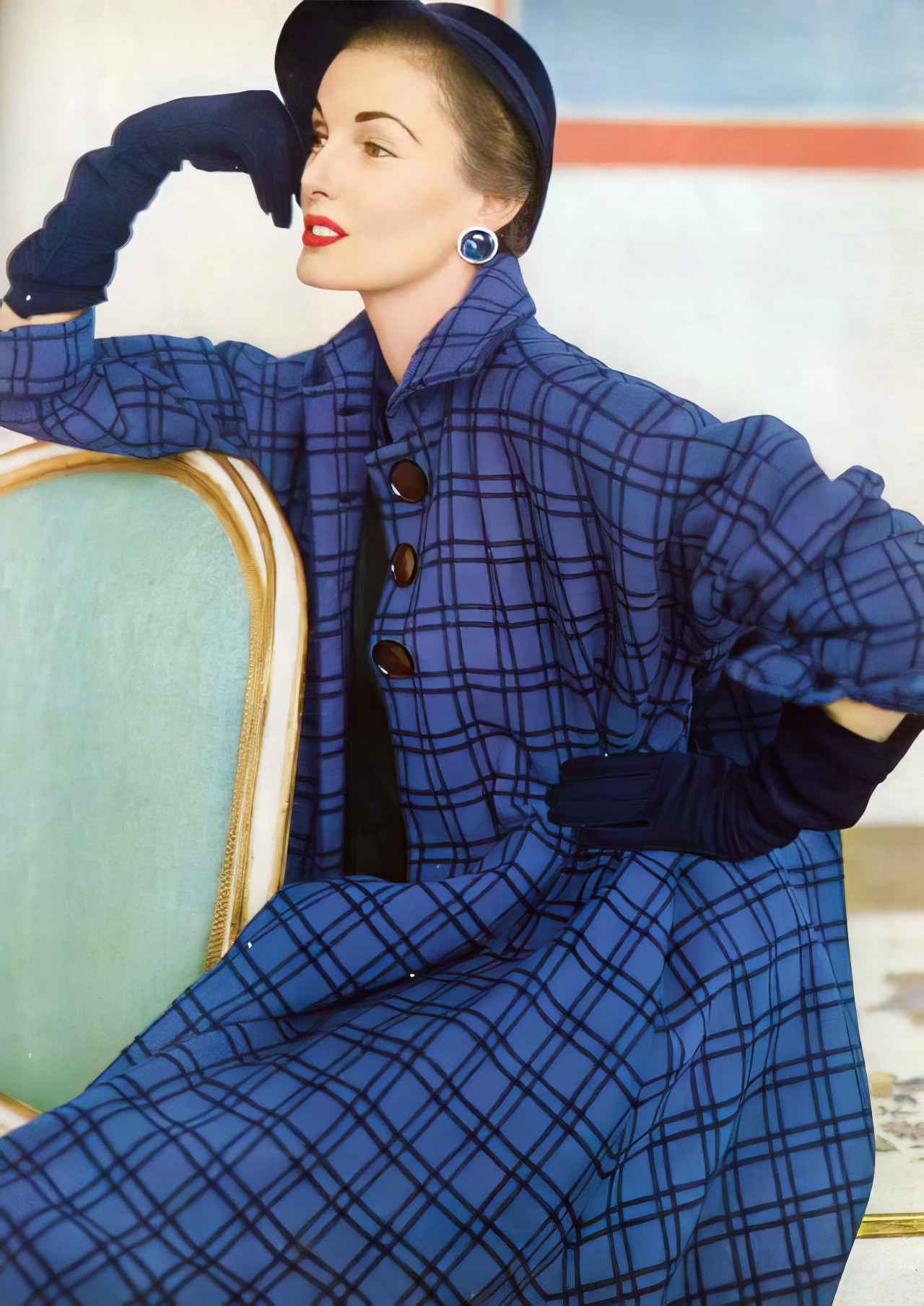 Elise Daniels in a blue and black check flared coat by Juilliard Wool for Junior Sophisticates, Vogue US, September 1951.