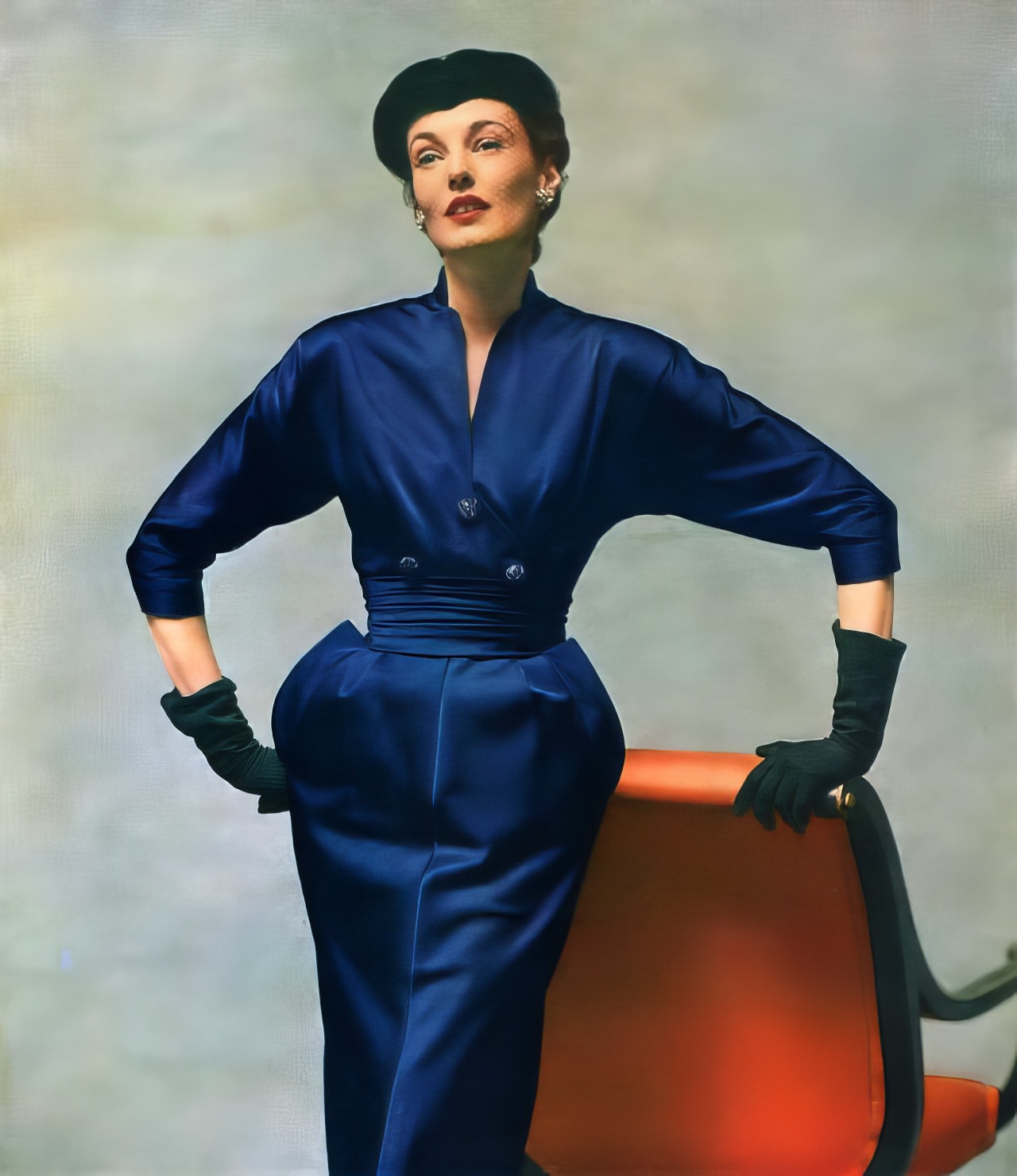 Elise Daniels in a blue rayon satin faille after-dark dress by Adele Simpson, Vogue, September 1, 1951.