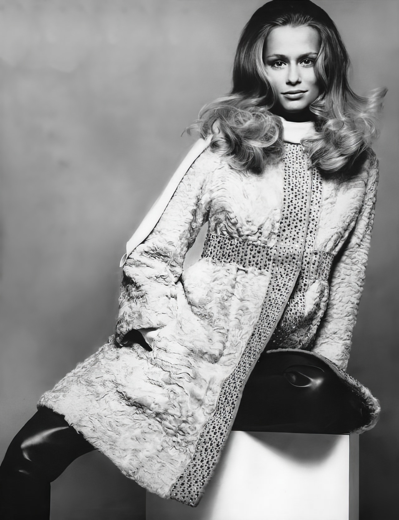 Lauren Hutton in a violet-dyed Swakara lamb coat by Chambers Sherwin, Vogue, November 1, 1968.