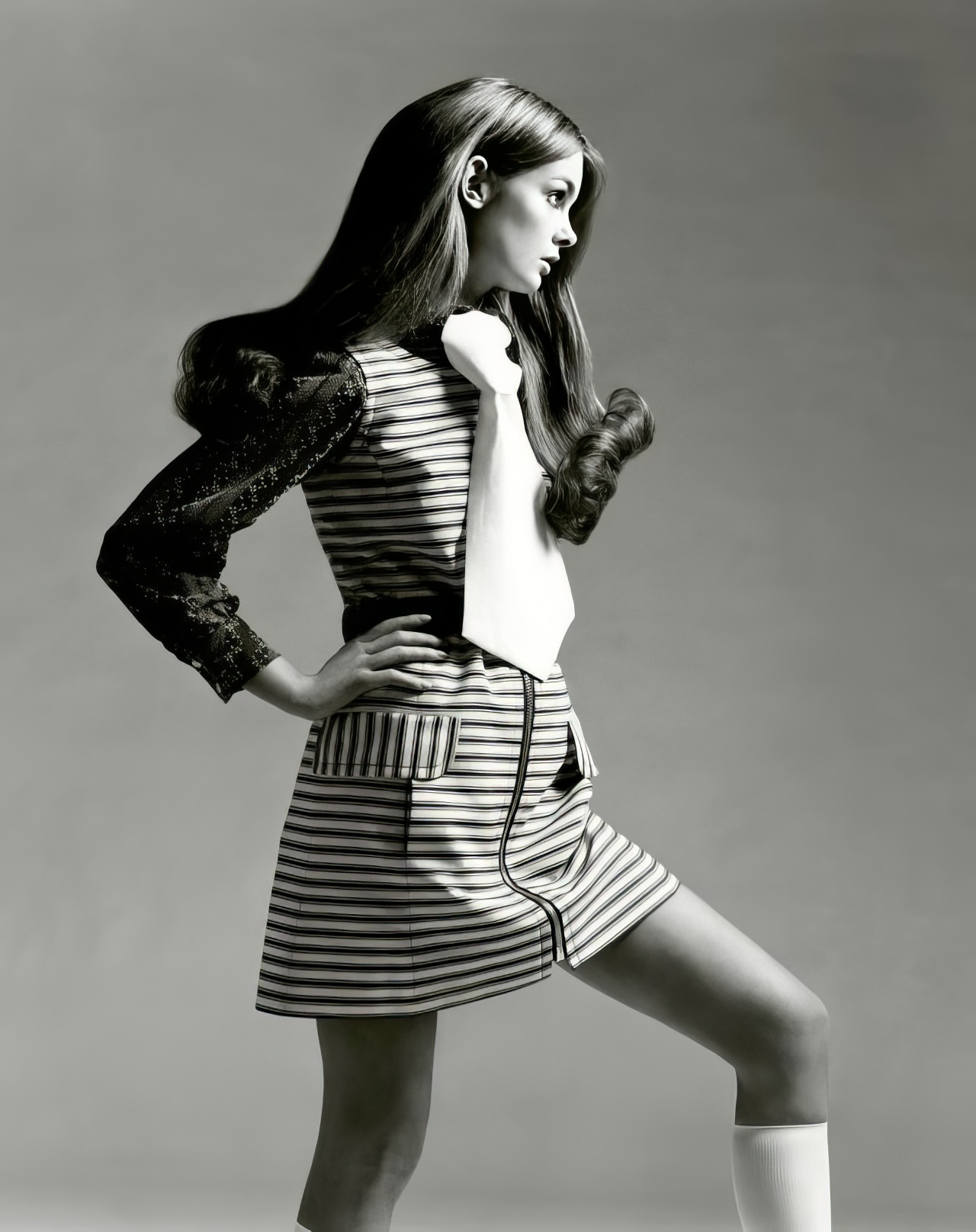 Jean Shrimpton in a striped denim mini-jumper, Vogue US, March 1969.