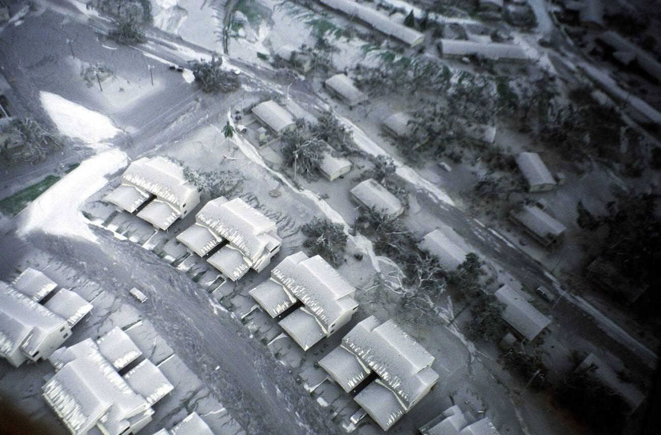 An aerial view of Clark Air Base, Luzon, Philippines, shows damaged trees and ash-covered roads after Mount Pinatubo's eruption.