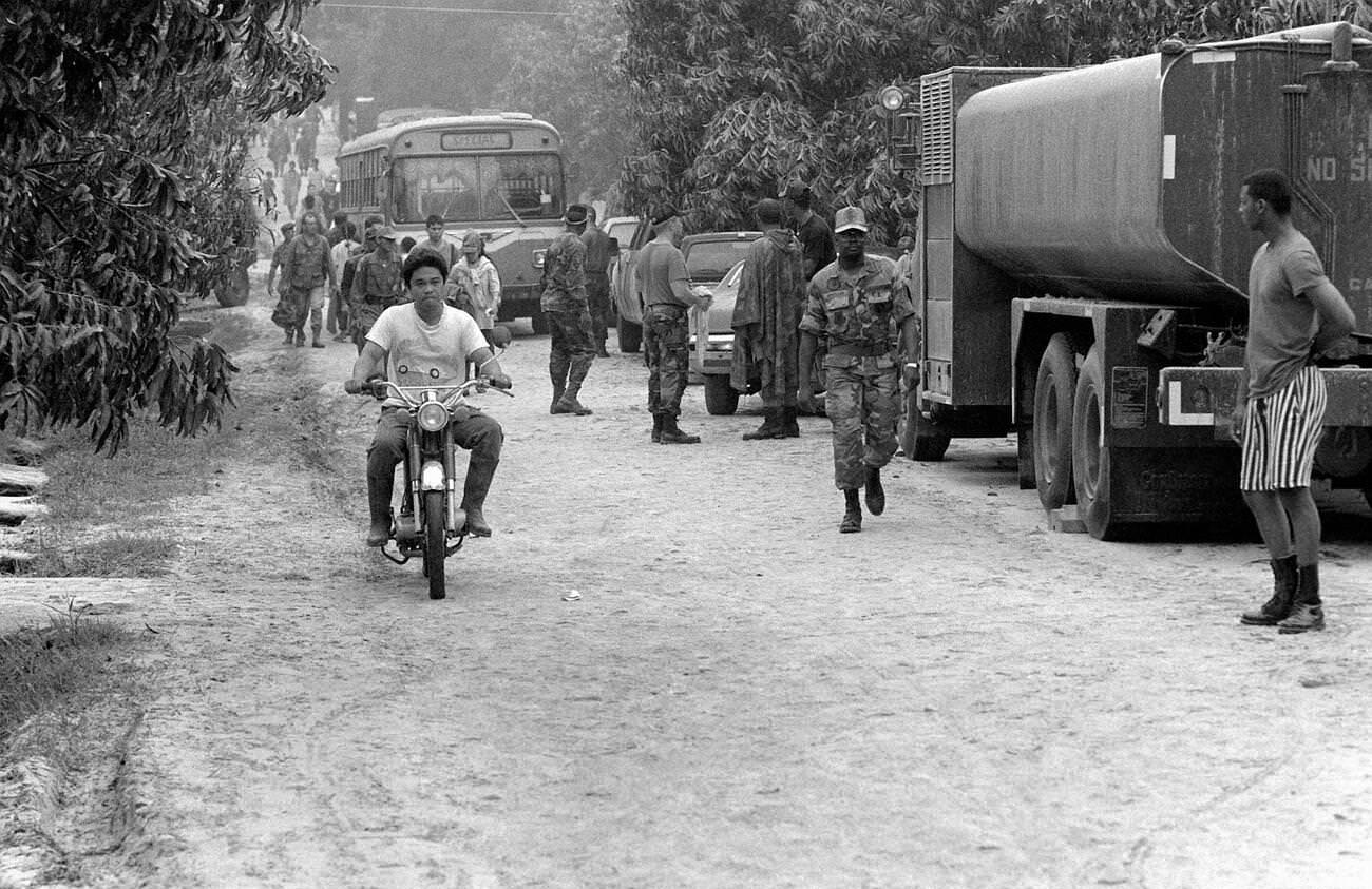 Local residents and military personnel evacuate the Philippines in the aftermath of Mount Pinatubo's eruption, which reawakened after over 600 years.