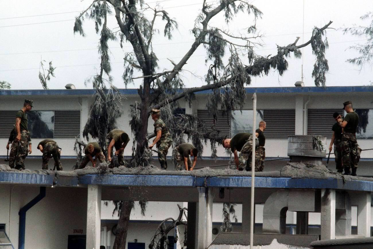 Marines clearing volcanic ash from the roof of Cubi Point galley at Naval Station Subic Bay