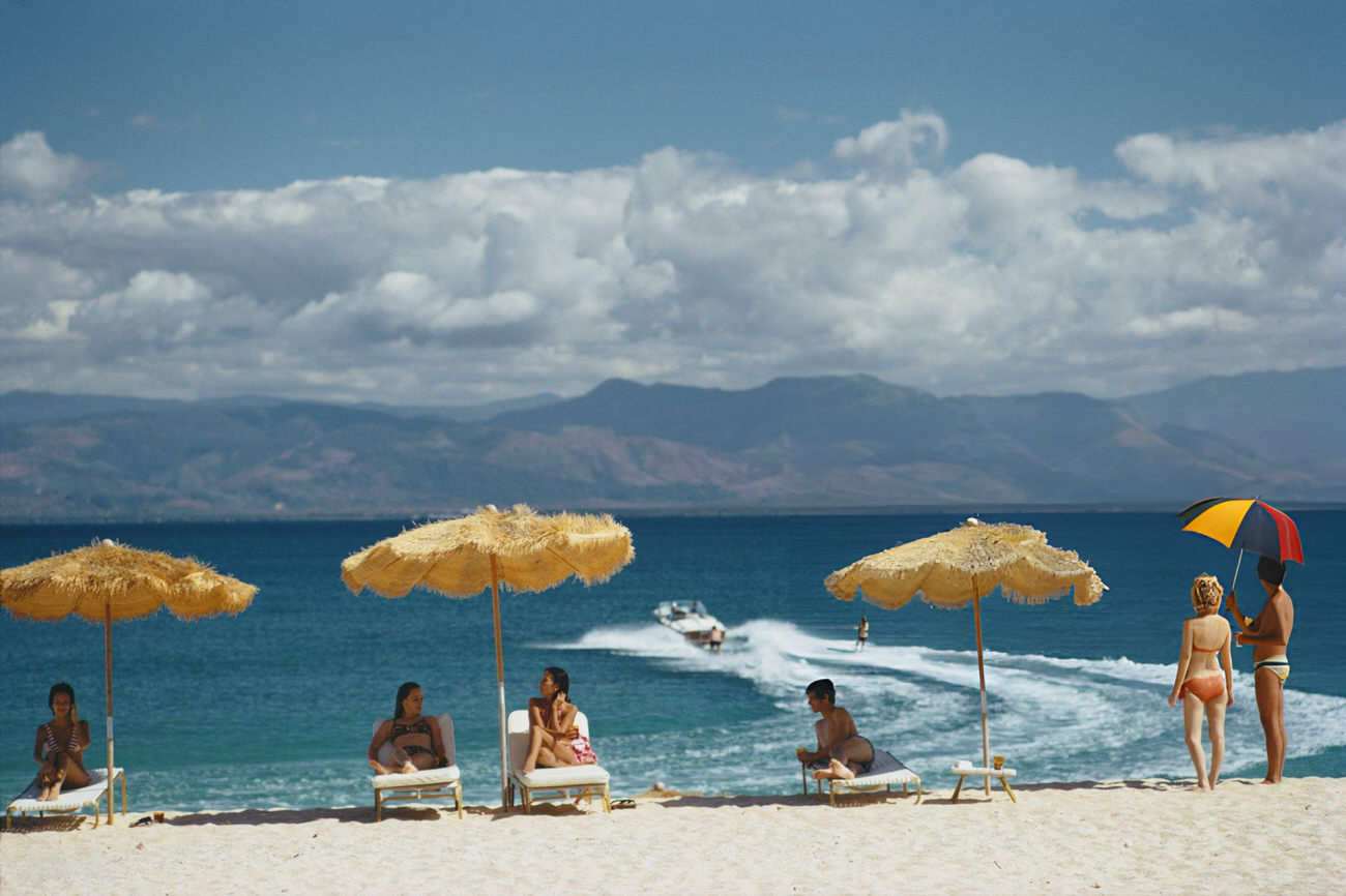 Guests on the beach of a private island owned by Philippine Airlines President Benigno Toda Jr., Philippines, February 1973.