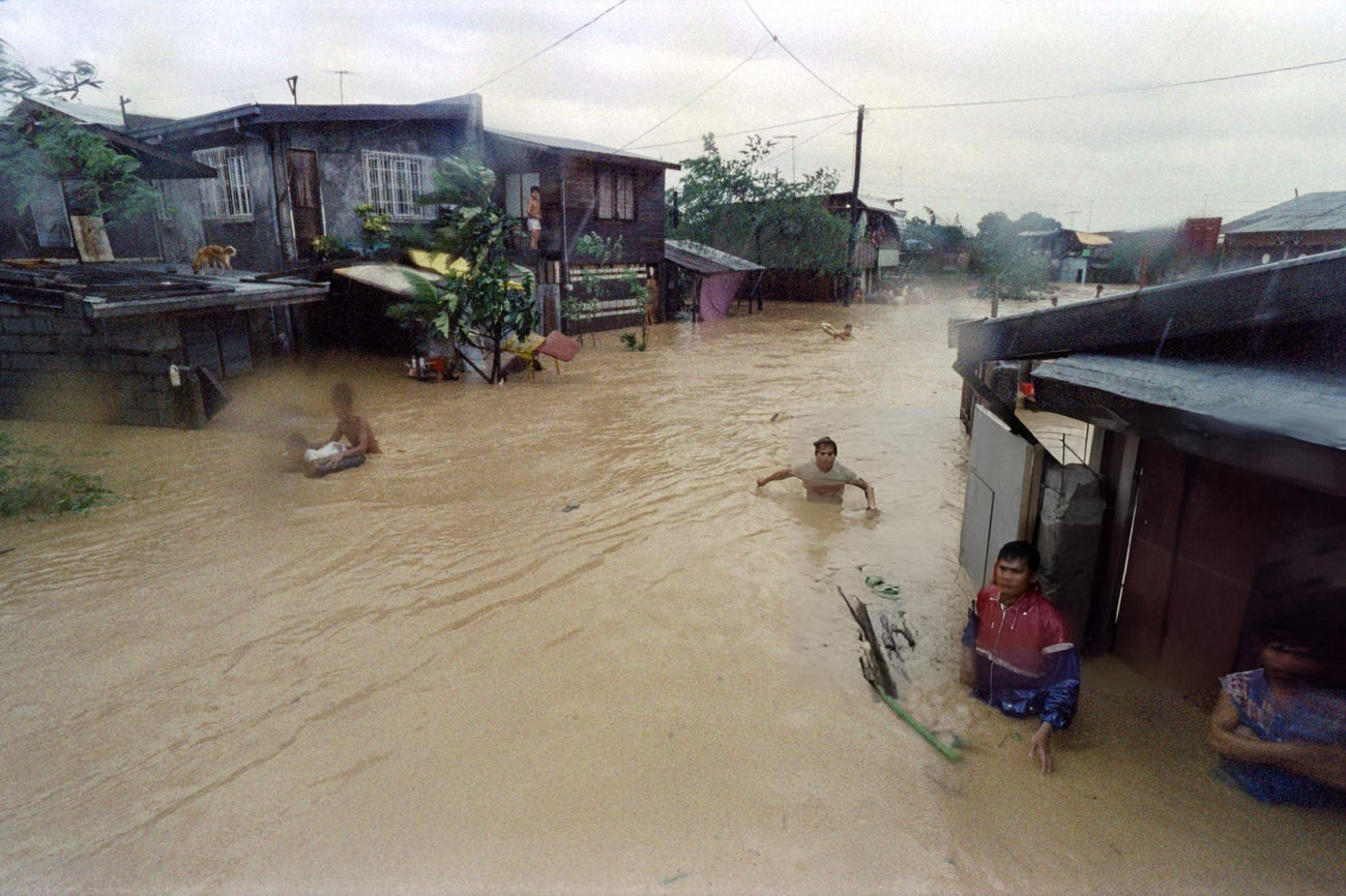 Residents flee flooding in Marikina City, Philippines, after Typhoon Ruby, October 25, 1988.
