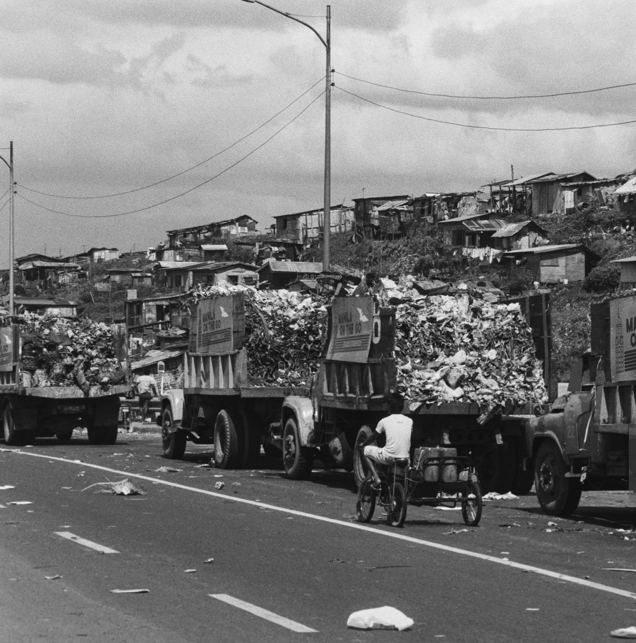 Garbage trucks at the 'Smoky Mountain' dump in Tondo, Manila, November 1987.