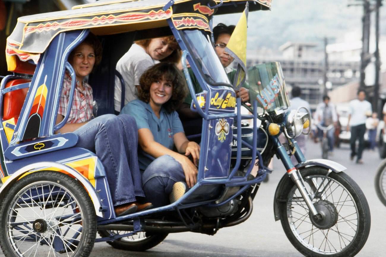 Dependent wives of USS STERETT crewmen riding in a jeepney, Philippines, 1982.