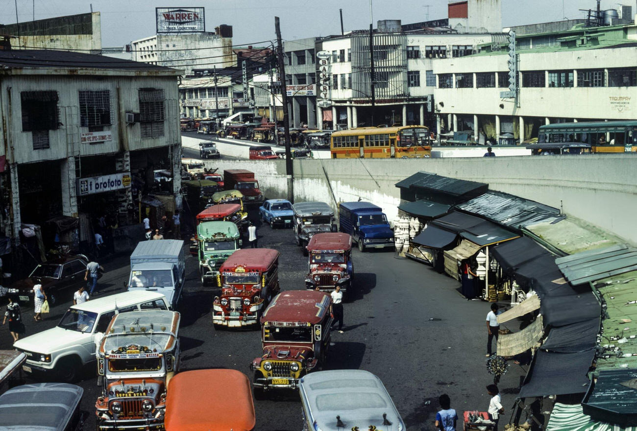 Jeepneys line a street in Quiapo district, Manila, Philippines, in July 1985.