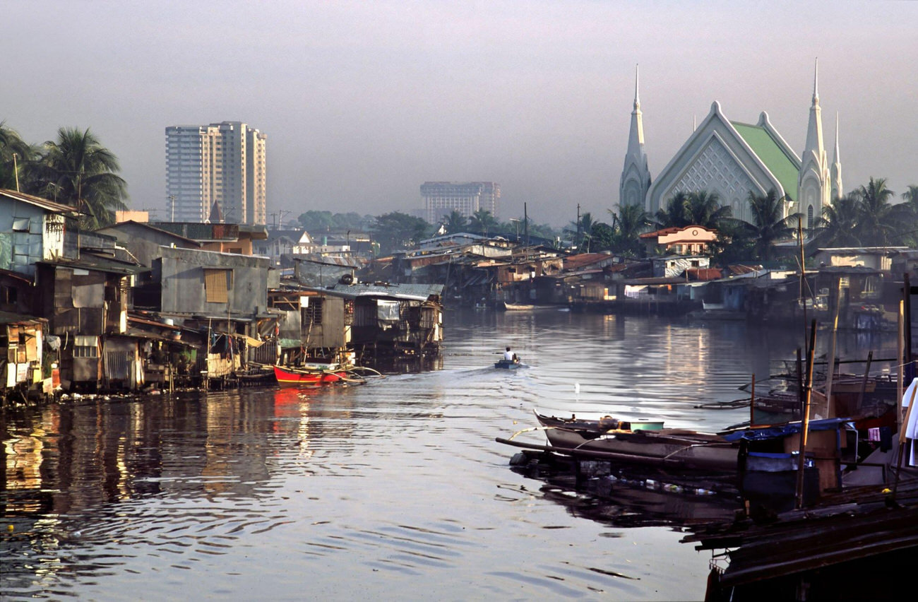 The juxtaposition of squalor and religion in Manila, Philippines.