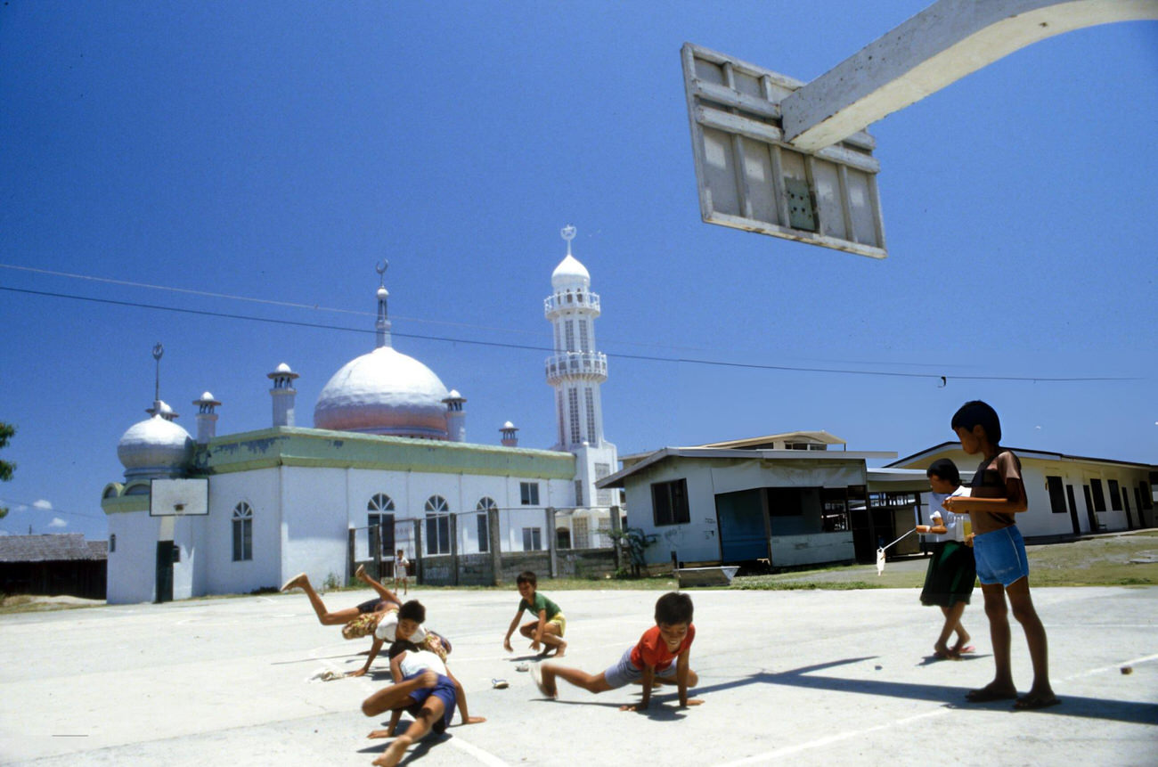 Children dance hip-hop near a mosque in the Philippines, June 1987.