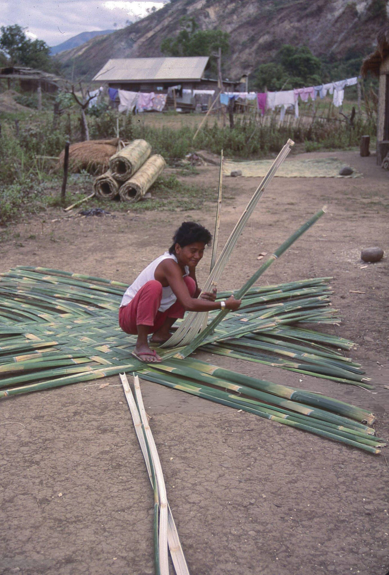 A woman crafts bamboo mats in Mountain Province, Philippines, July 1988.