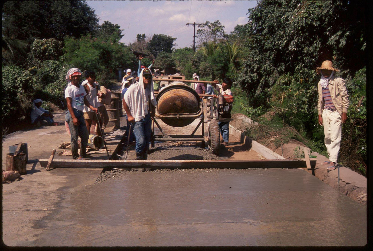 Road workers at the Payatas Dumpsite, Manila, Philippines, July 1988.