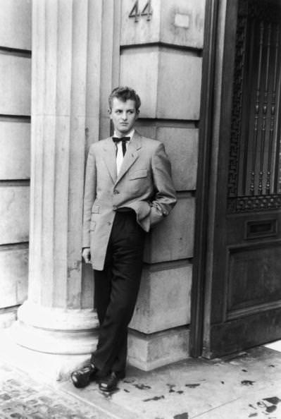 Alec Cruickshank, a clerk in a City of London shipping office poses ready to go into Mecca’s Royal Dance Hall, Tottenham, on 29th May 1954.