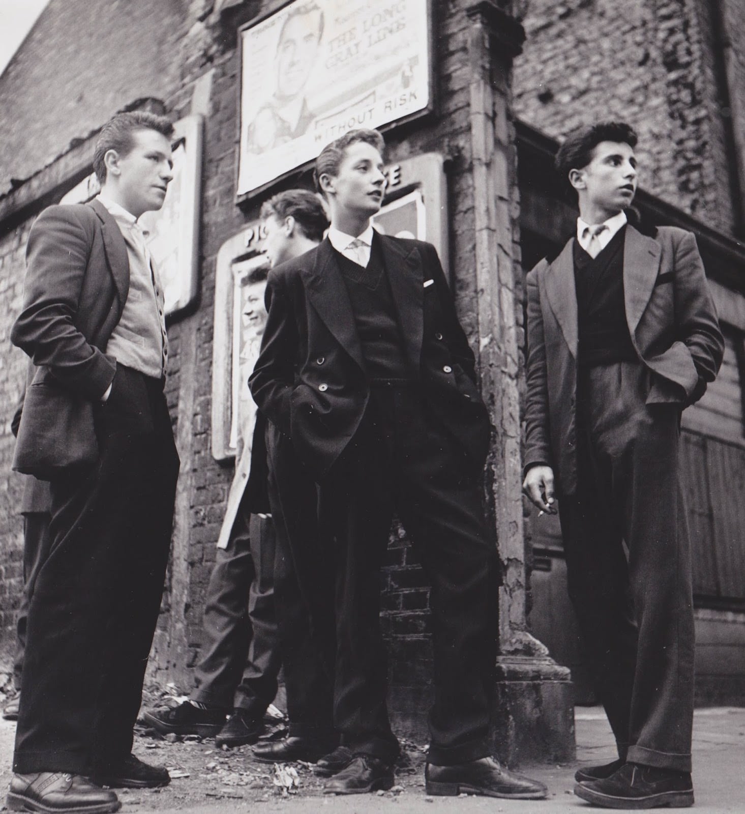 Teddy Boys gather outside a Picture House on the Old Kent Road, 1955.