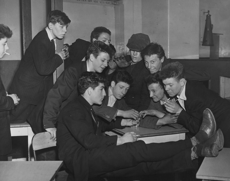 A group of Teddy Boys smoking cigarettes at the Rodney Youth Centre in Liverpool, April 1956