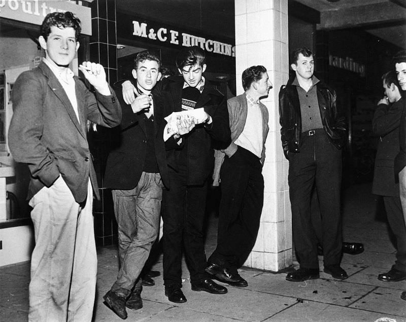 The fish and chip shop, the youths main meeting place in the new town of Newtown Aycliffe, Durham, October 1959.