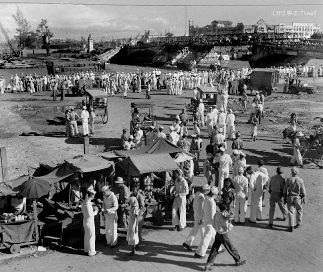 American sailors on the north bank of the Pasig River east of the Jones Bridge, Manila, Philippines, September 1945