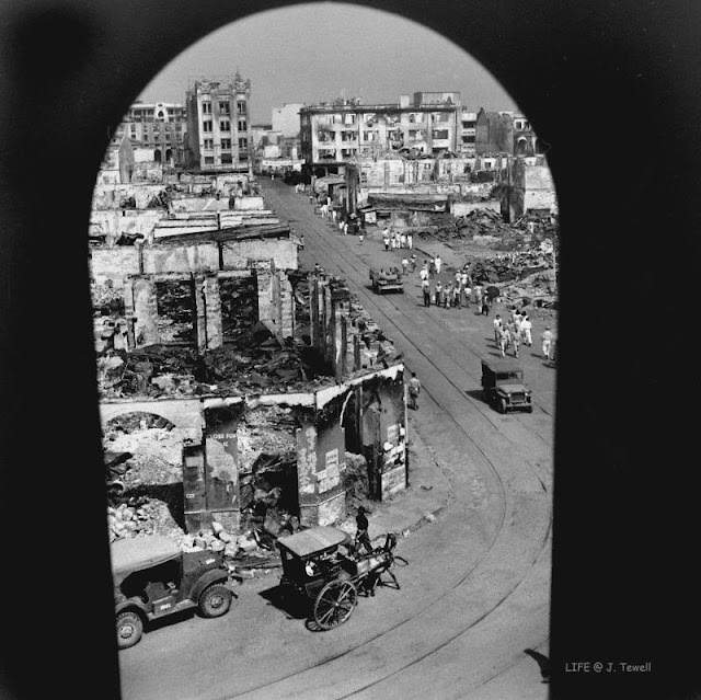 Looking west down Carriedo Street from the west church tower, Quiapo Church, Manila, Philippines, May 1945