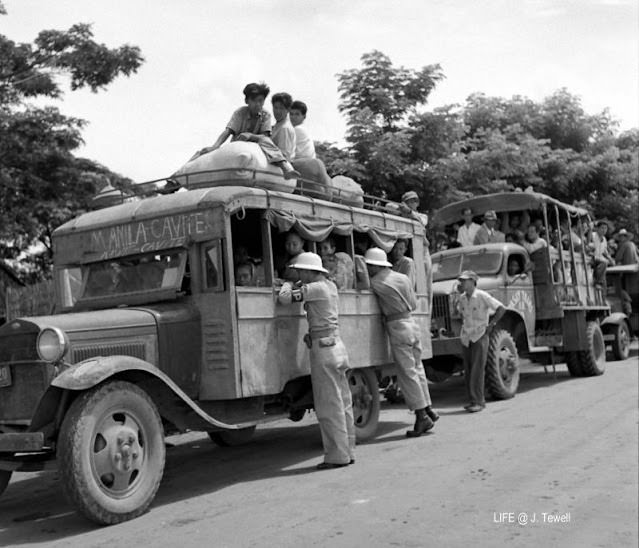 Manila to Cavite bus being checked by Military Police, September 1945