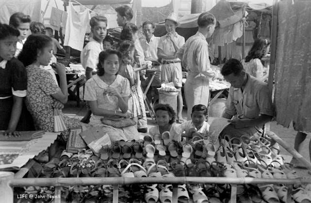 Shoes in a market, near the WWII ruins of Santa Cruz Church, Manila, Philippines, May 1945