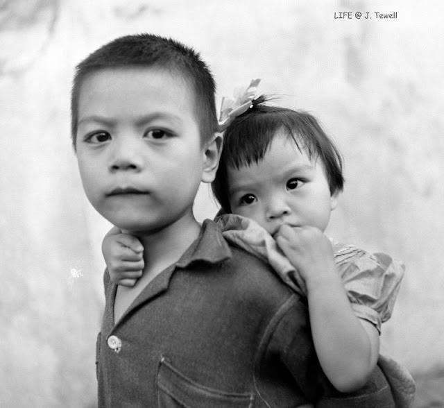 The eyes tell the truth, sadness, and innocence stolen, WWII Manila, Philippines, 1945