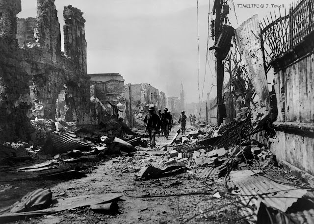 American soldiers entering Intramuros. Manila, Philippines, March 2, 1945.