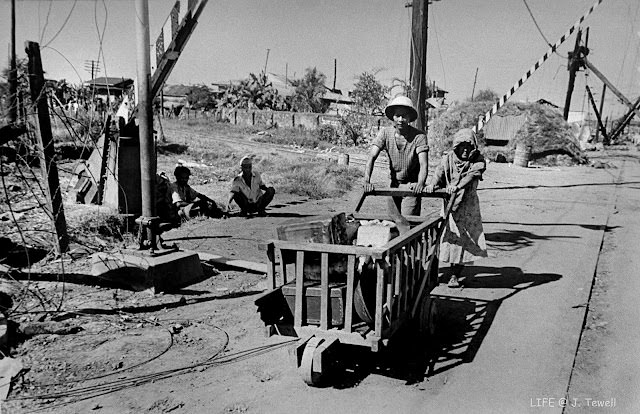 Filipinos citizens fleeing the fighting. Manila, Philippines, Feb. 1945.