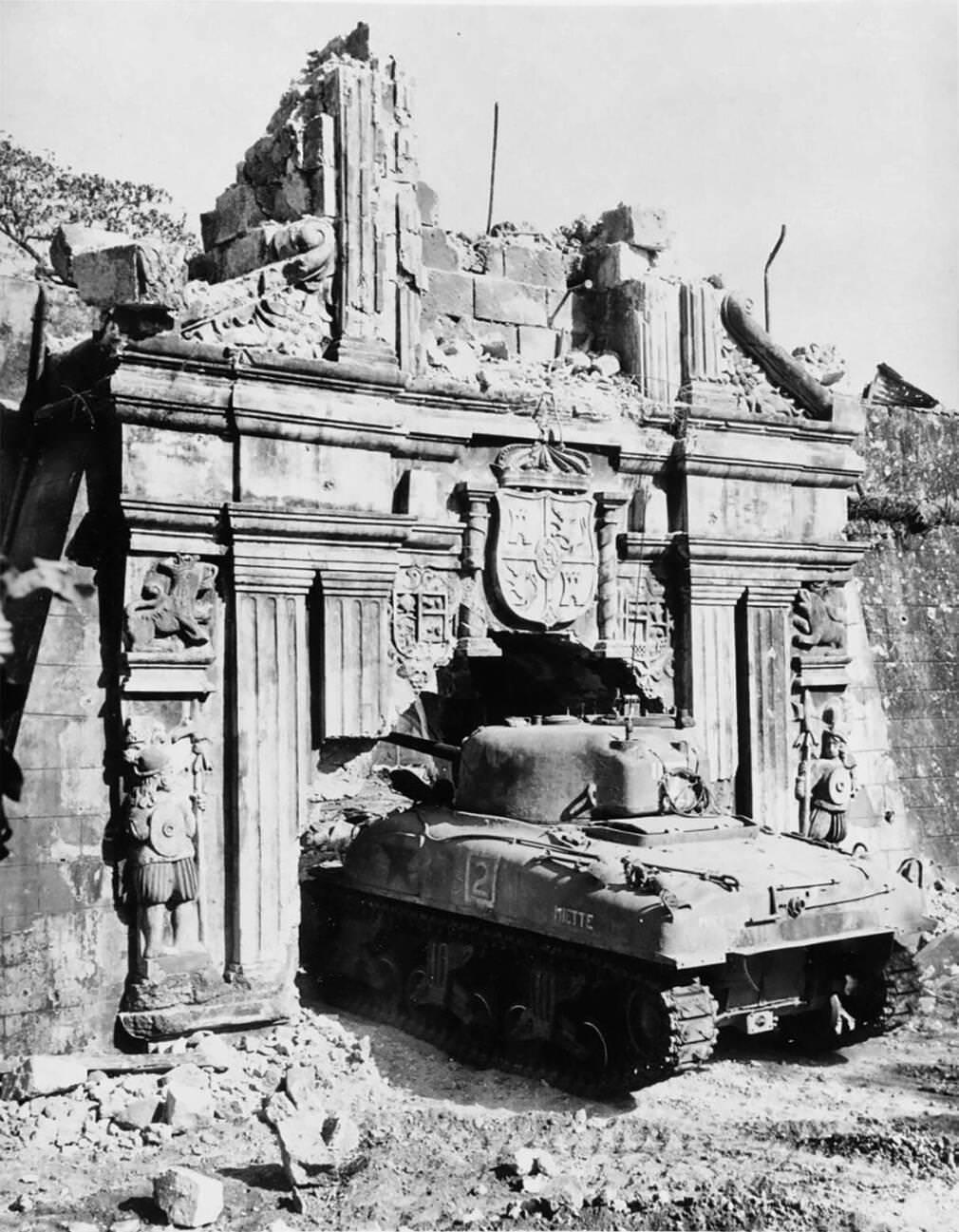 A U.S. Army M4 Sherman tank enters Fort Santiago through an enlarged gate during the Battle of Manila, 1945.