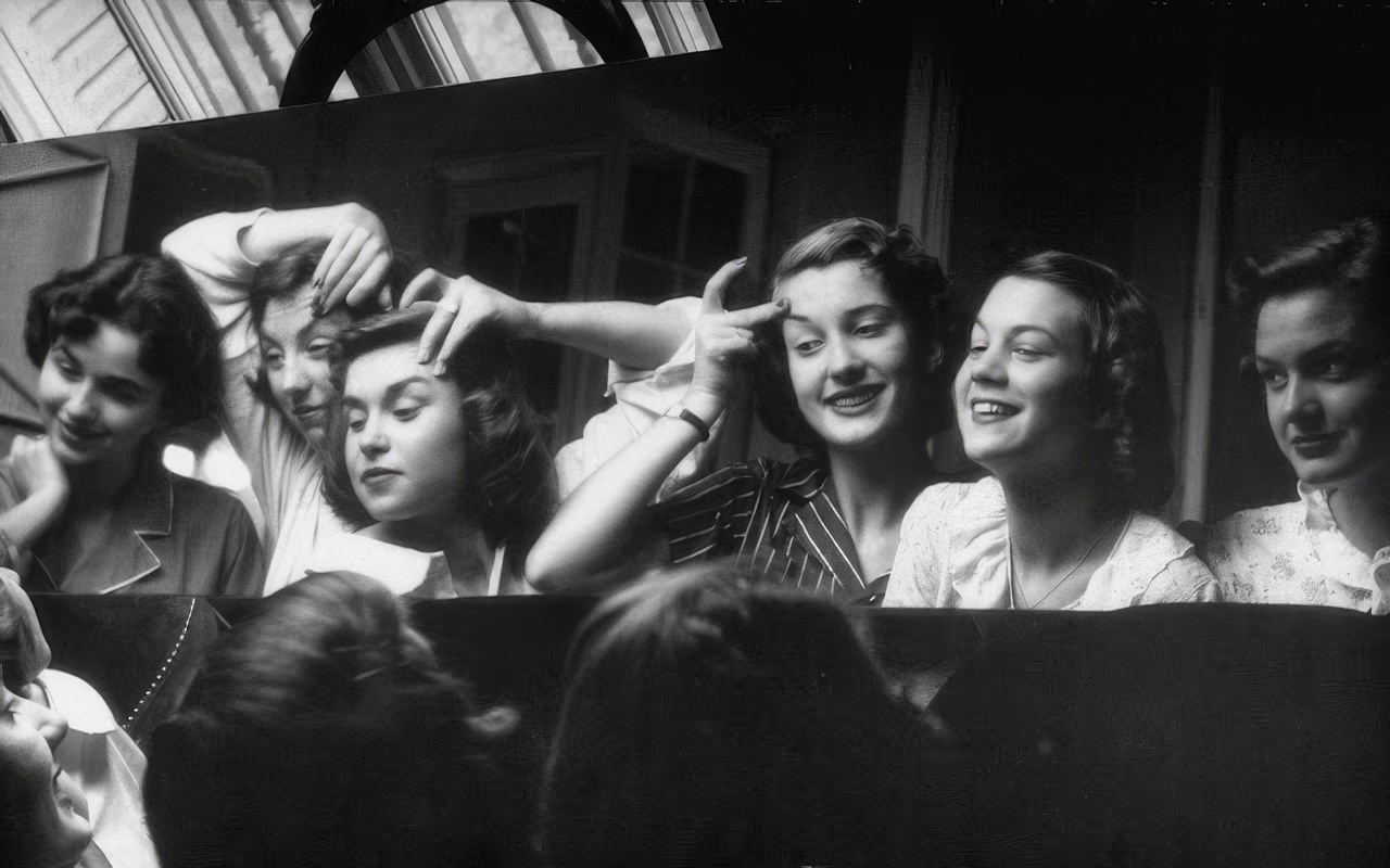 Eyebrow raising is an art practiced before a mirror by the "Horrible Six" during a slumber party at Anne Montgomery's home. They think that a deftly lifted brow gives them a mature Parisian charm.