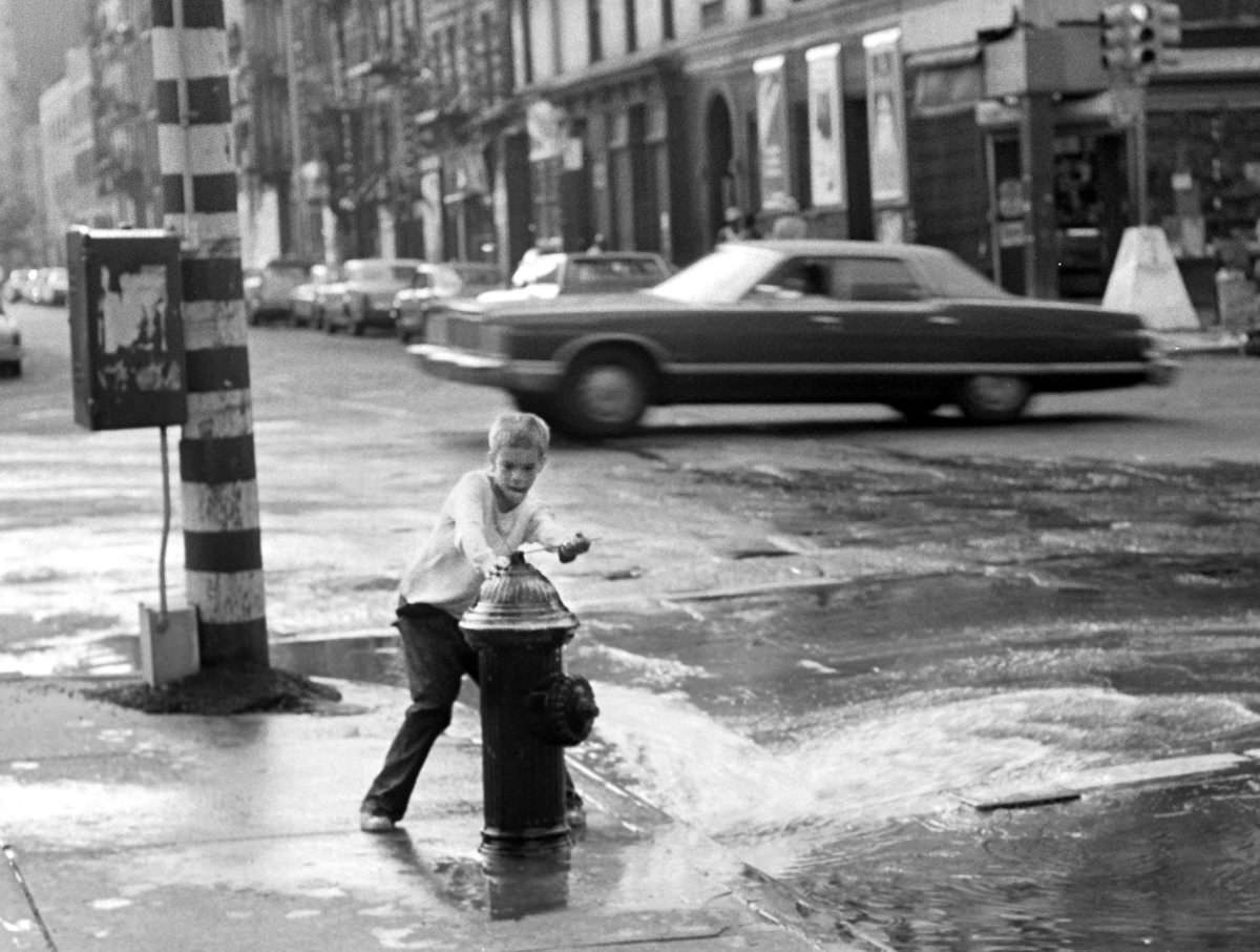 Fernando in charge of a hydrant on 2nd Avenue and 3rd Street, 1975.